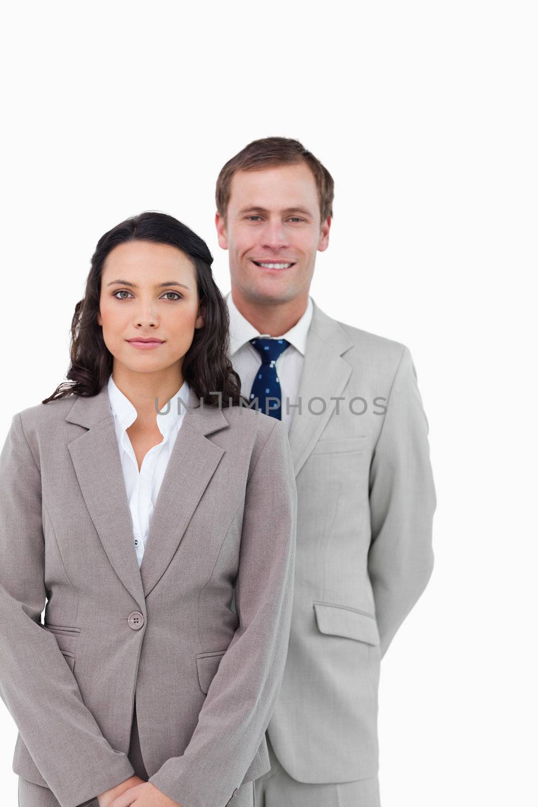 Businesspeople standing together against a white background