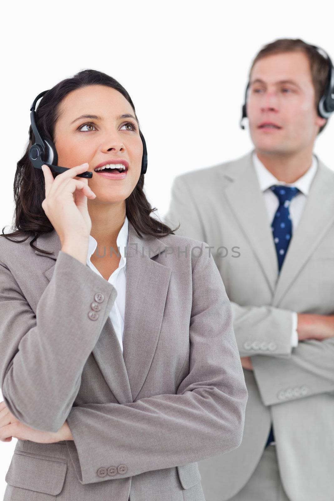 Call center agents at work against a white background