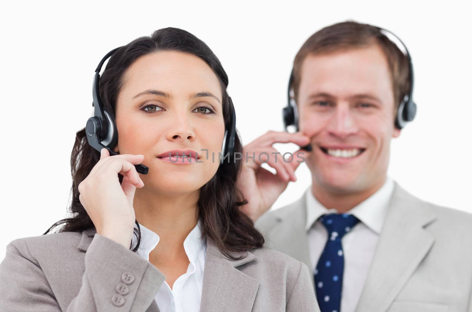 Call center team with their headsets against a white background