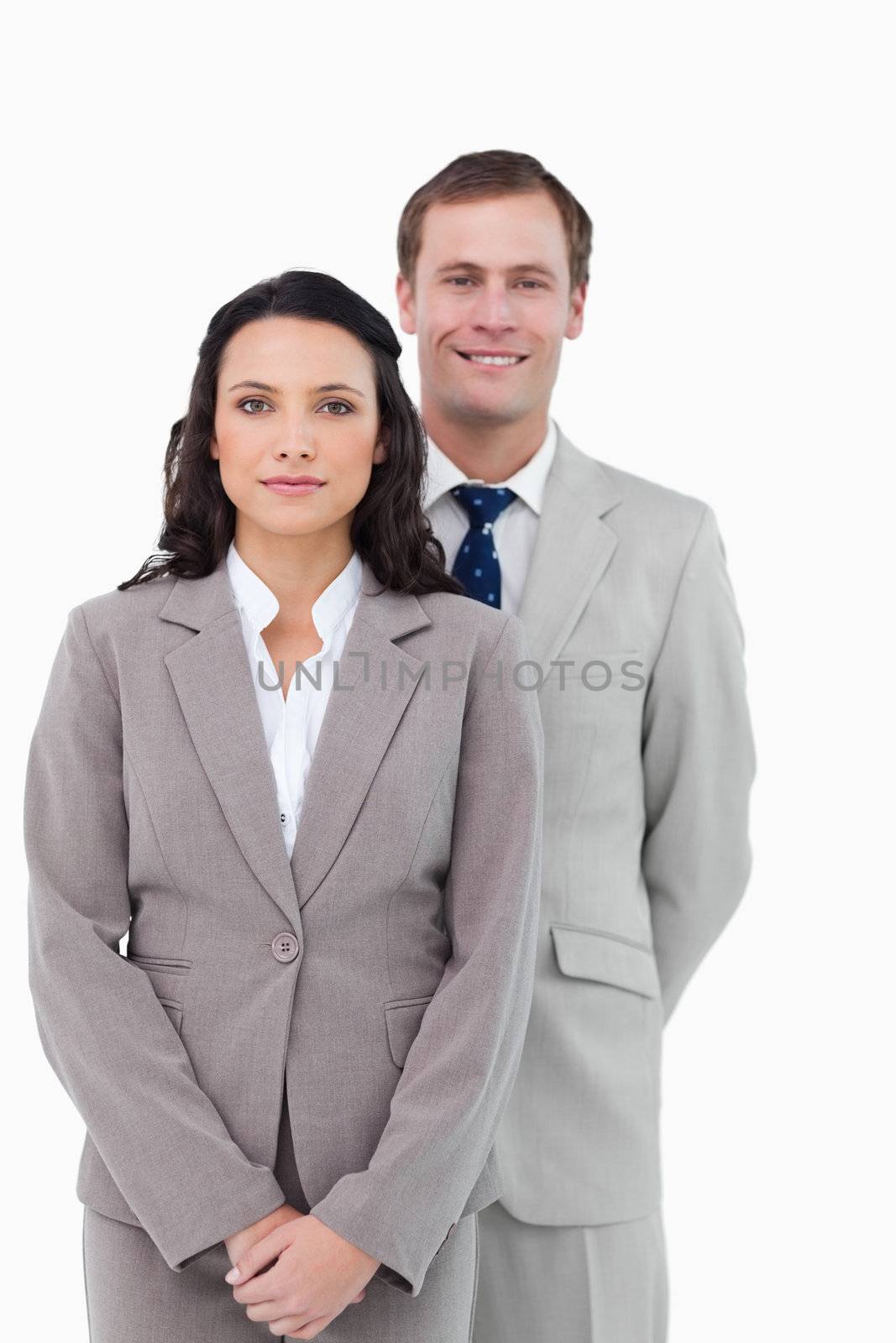 Office staff standing together against a white background