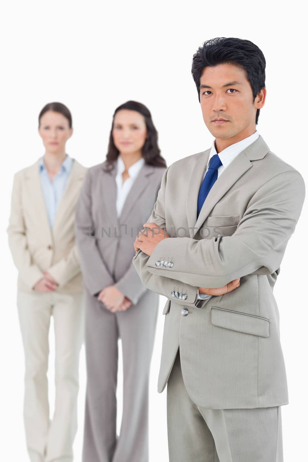 Confident looking businessman with his team behind him by Wavebreakmedia