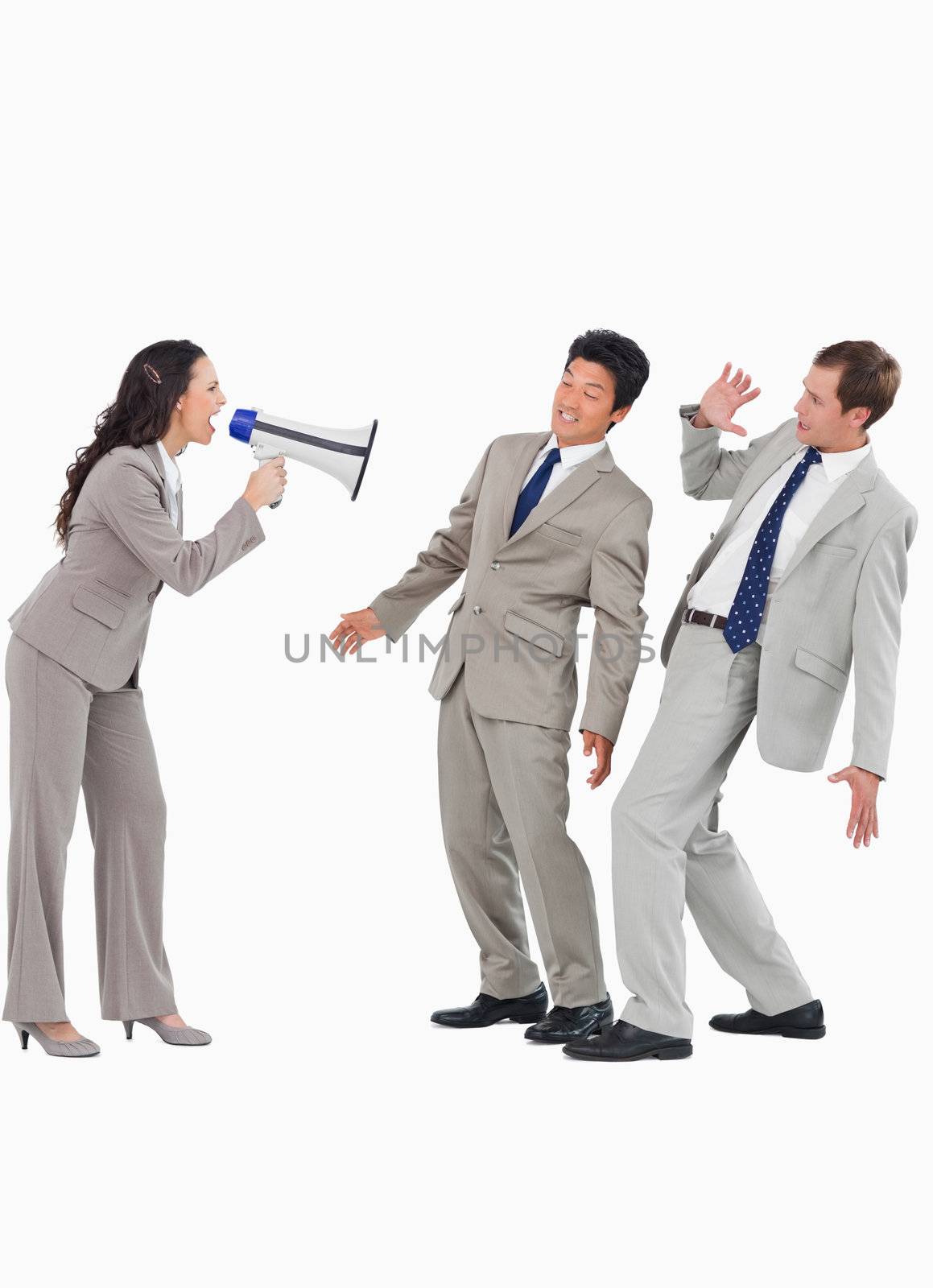 Saleswoman with megaphone yelling at colleagues against a white background
