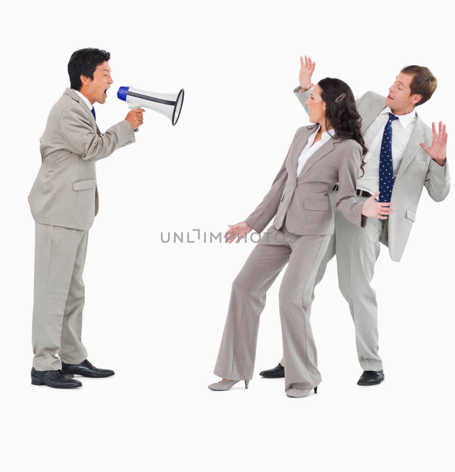 Salesman with megaphone shouting at colleagues against a white background