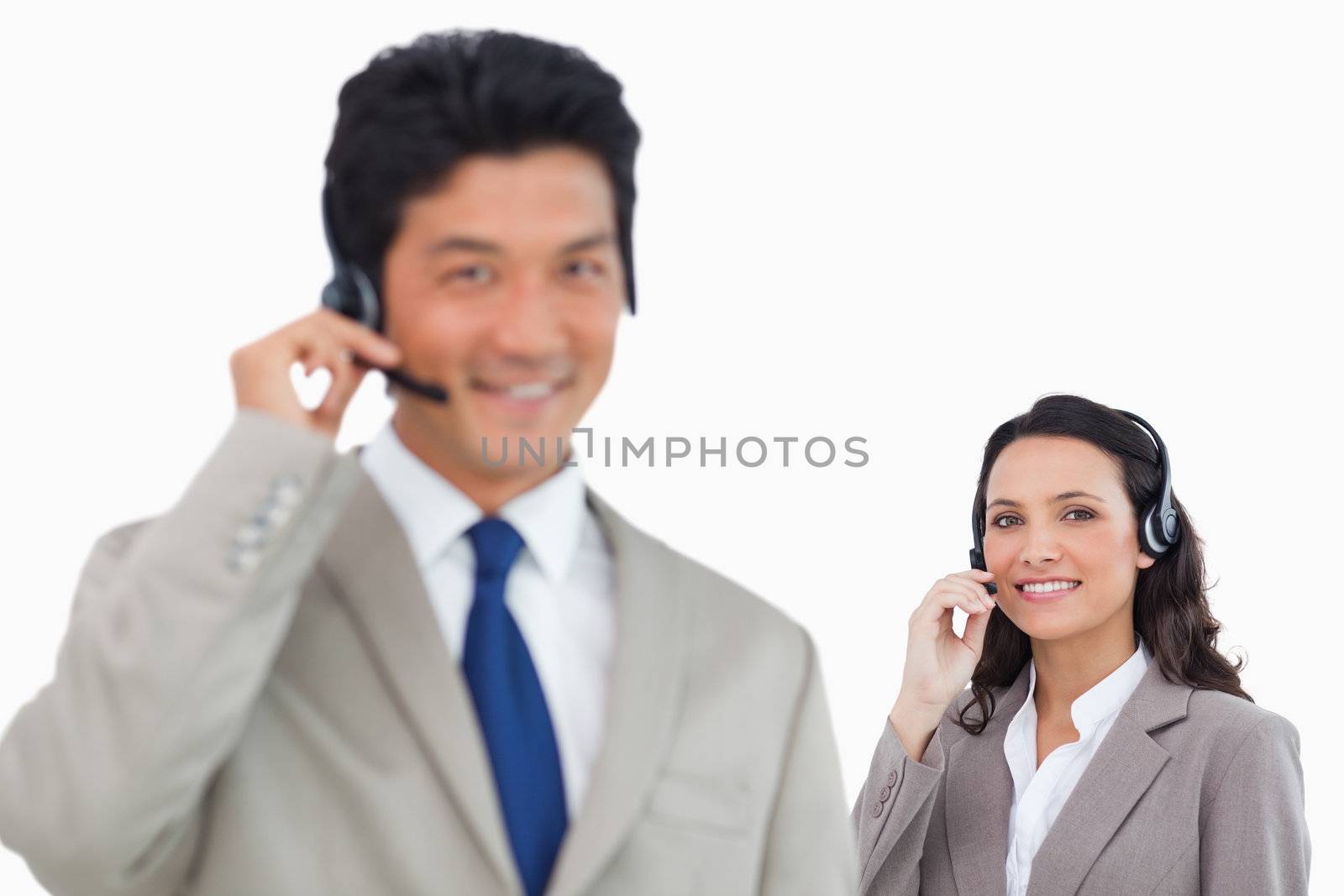 Young call center team against a white background