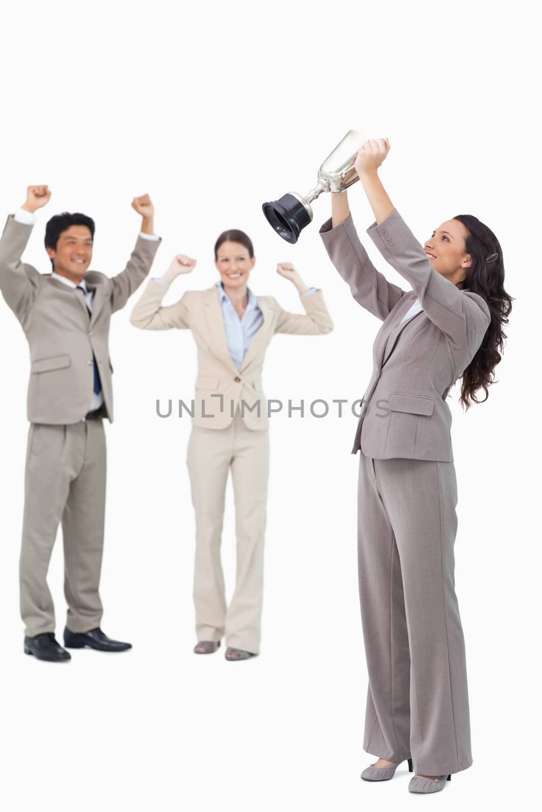 Victorious businesswoman with cup against a white background