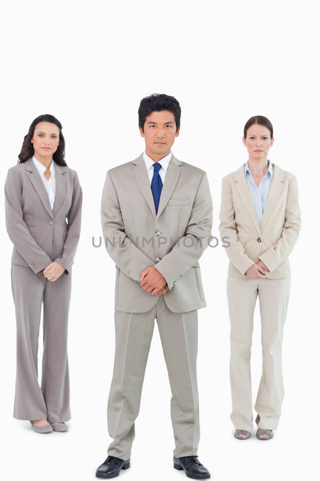 Confident looking salesteam against a white background