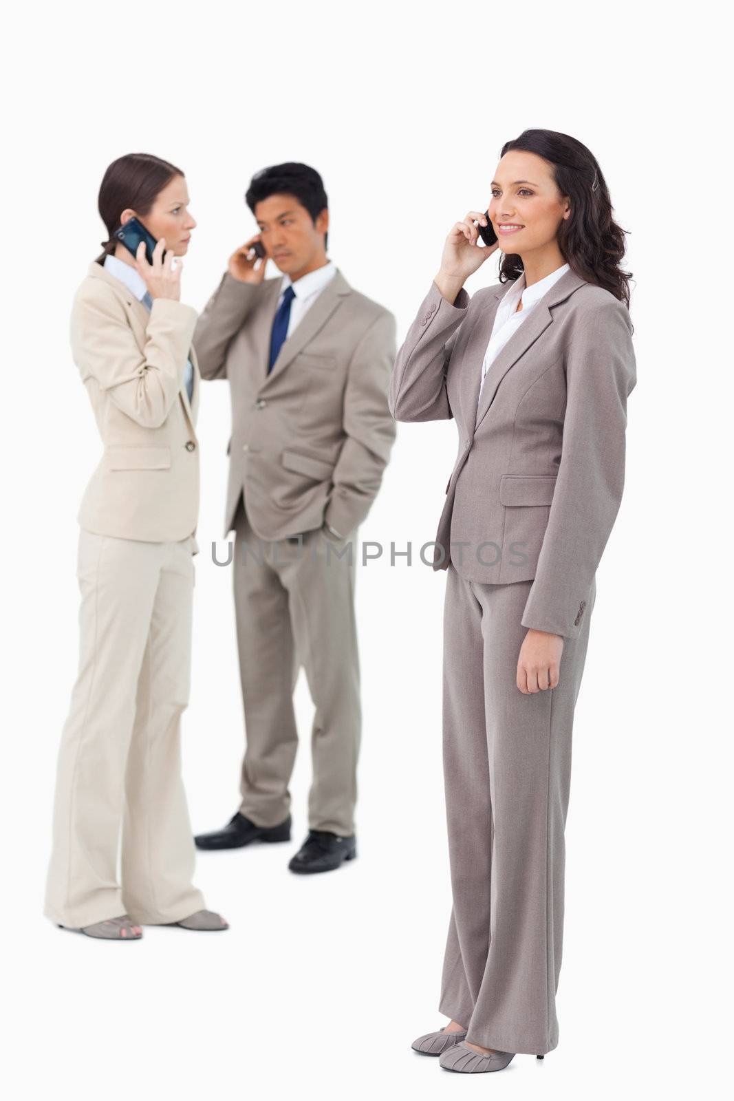 Salespeople on their phones against a white background