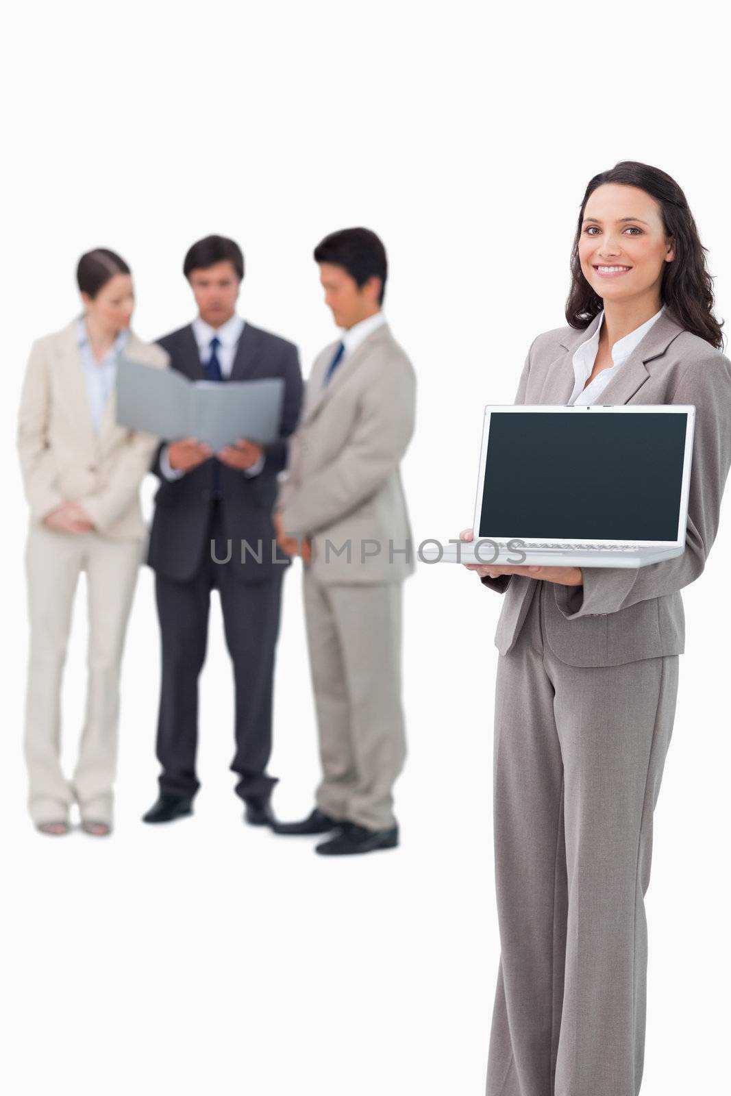 Saleswoman showing laptop screen against a white background