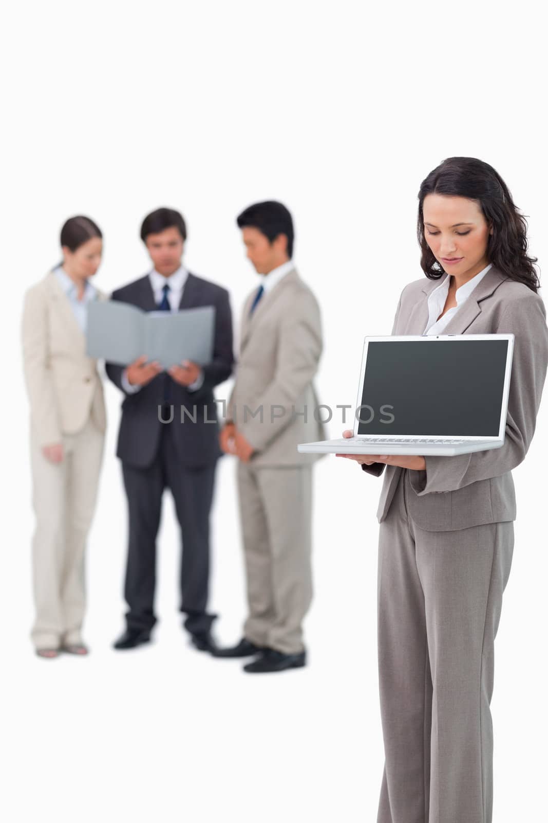 Saleswoman showing the screen of her notebook against a white background