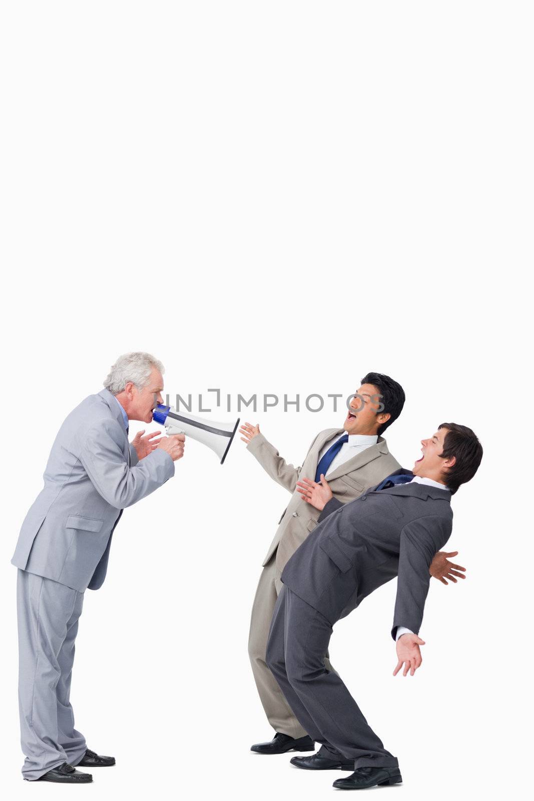 Mature salesman with megaphone yelling at his employees by Wavebreakmedia