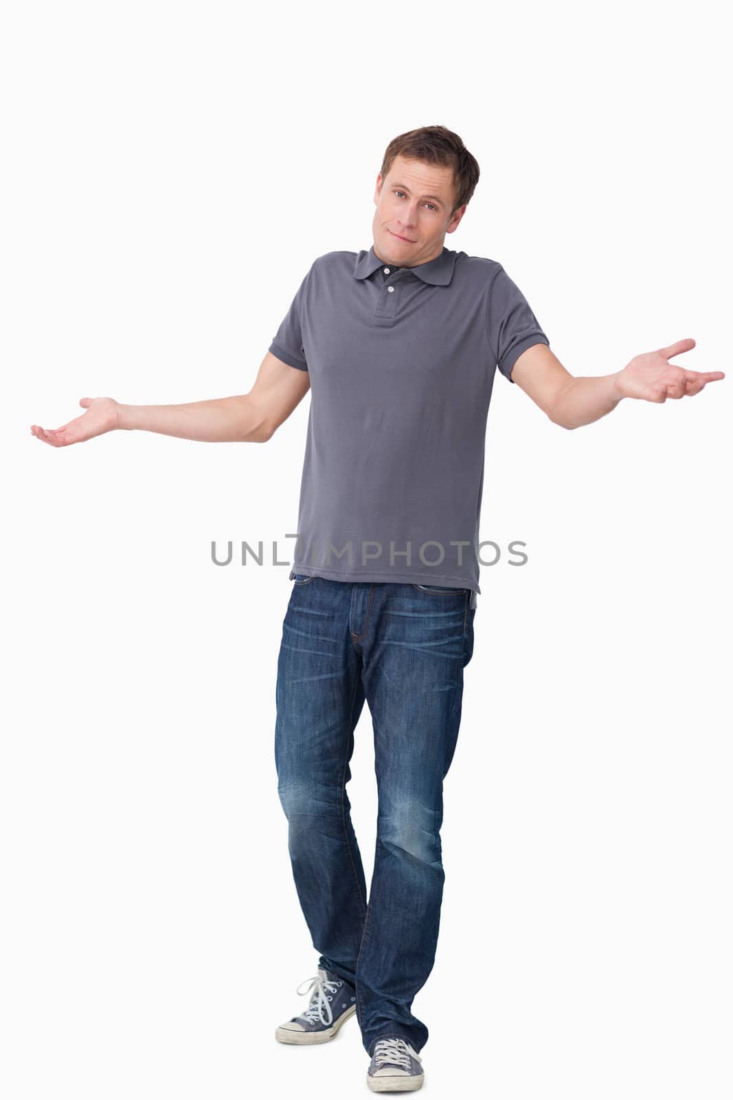 Clueless young man against a white background