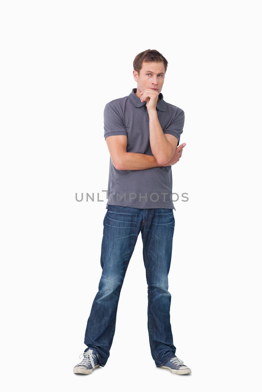 Thoughtful young man against a white background
