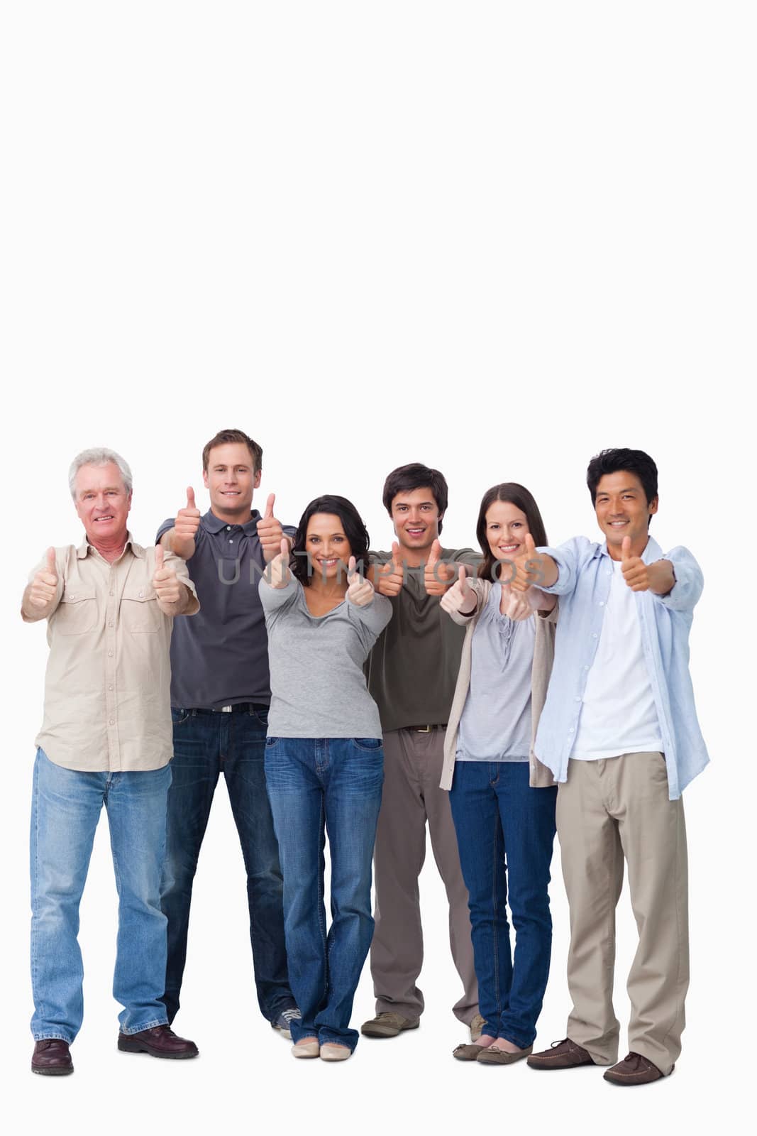 Smiling group giving thumbs up against a white background