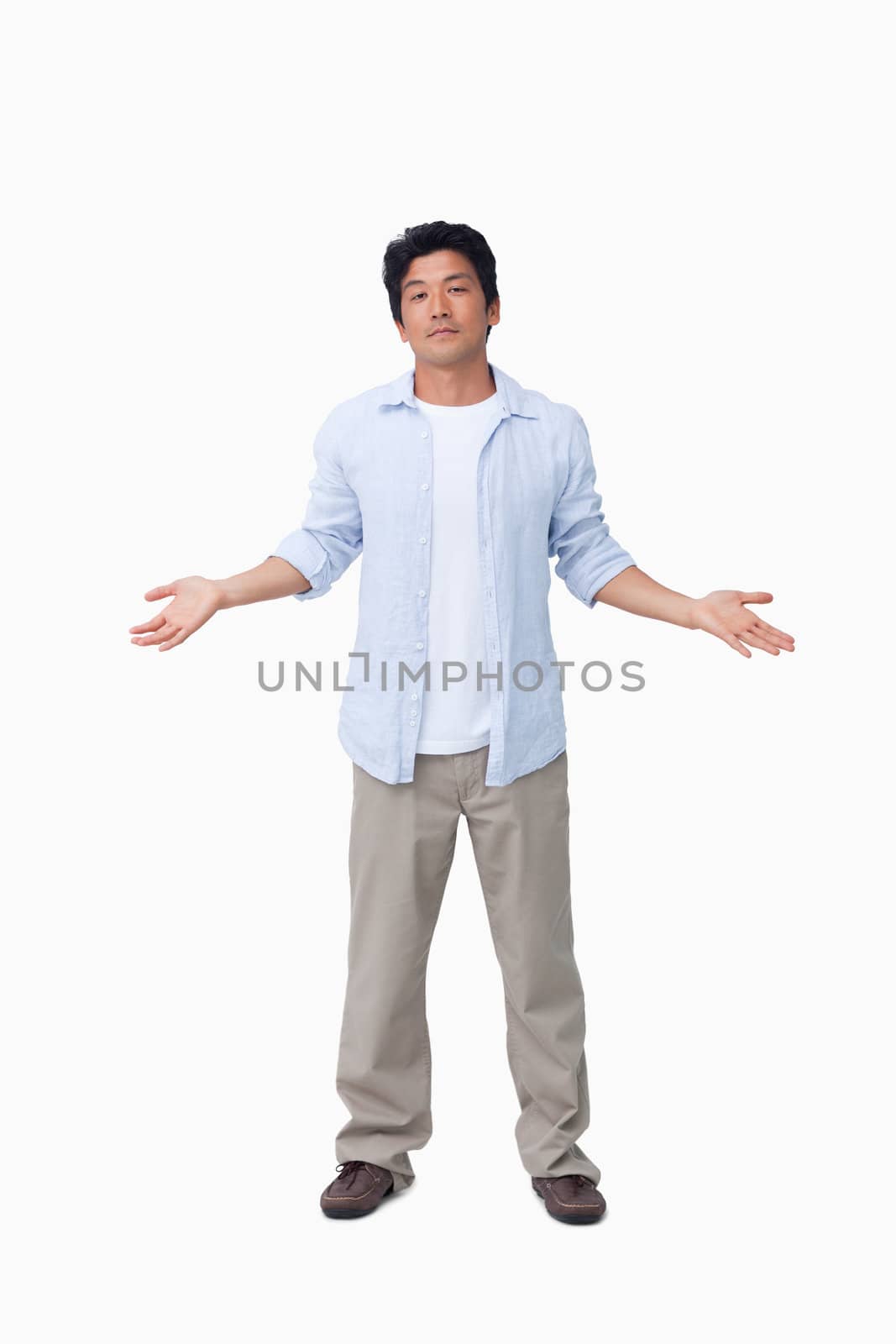 Clueless young male against a white background