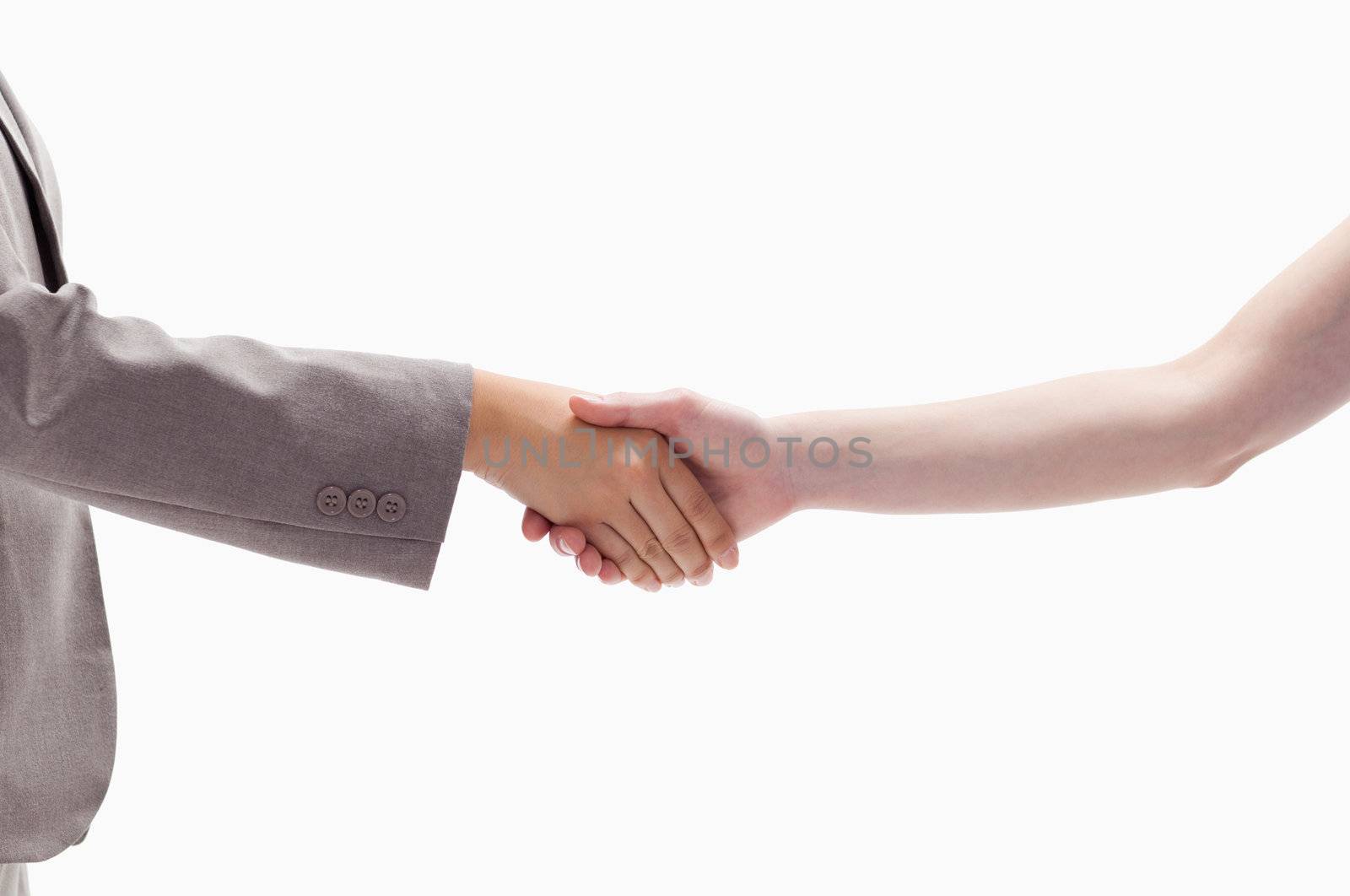 Close-up of a handshake against white background