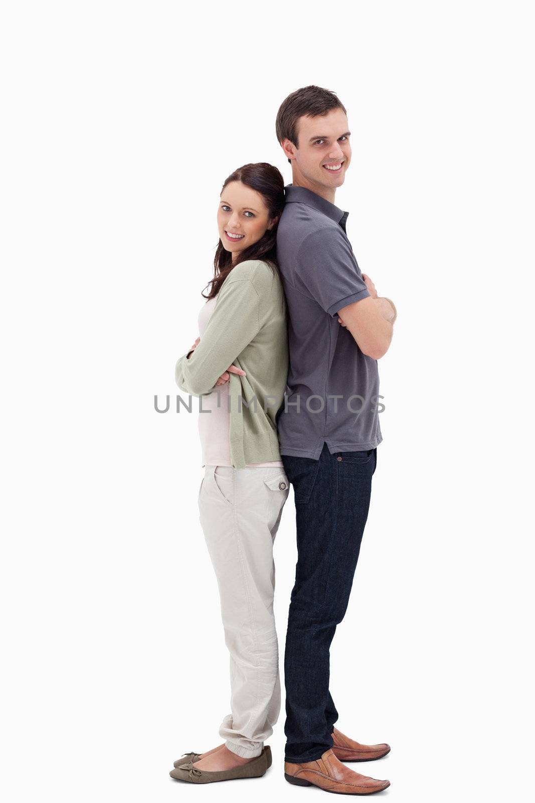 Couple back to back against white background