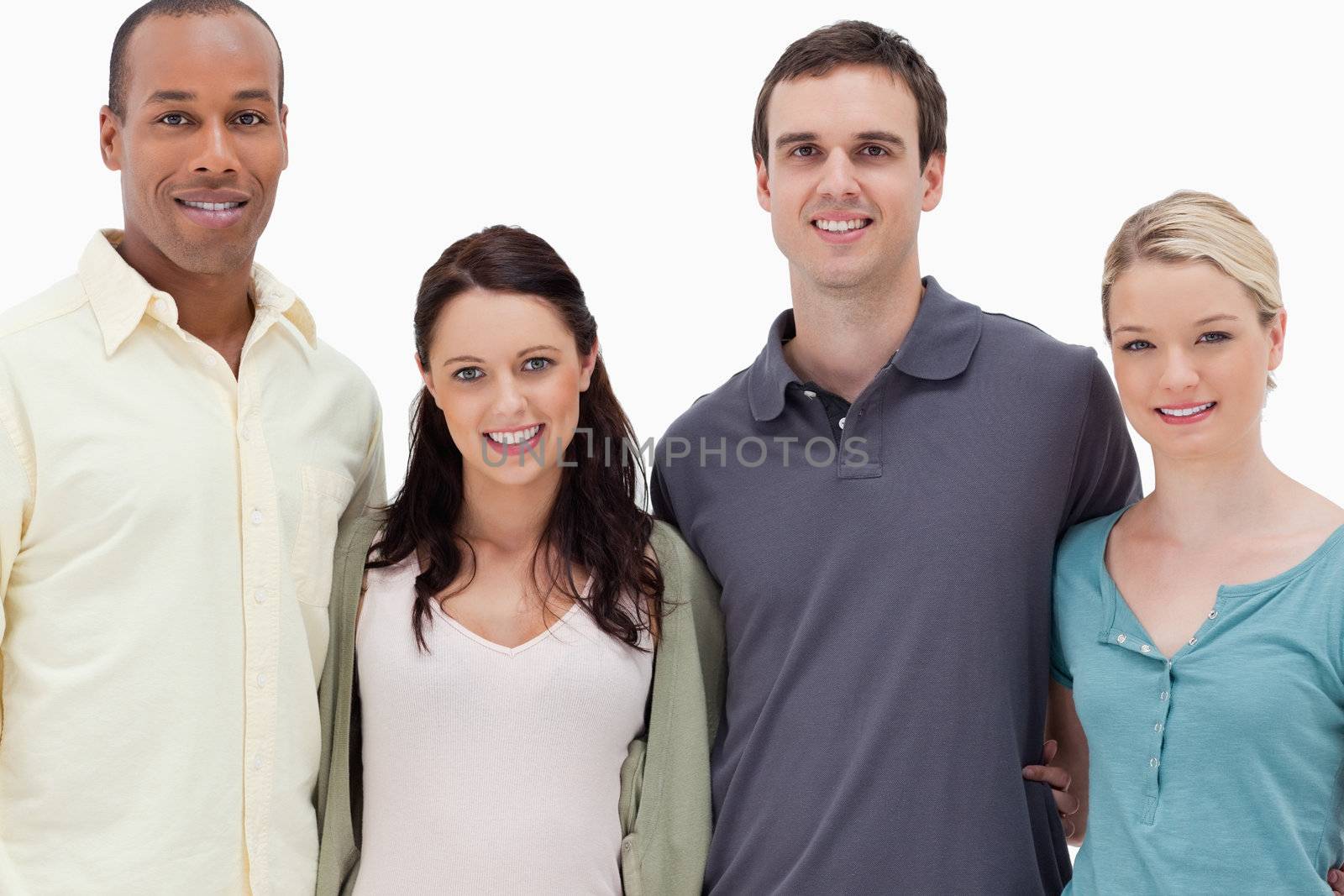 Close-up of two couples smiling against white background