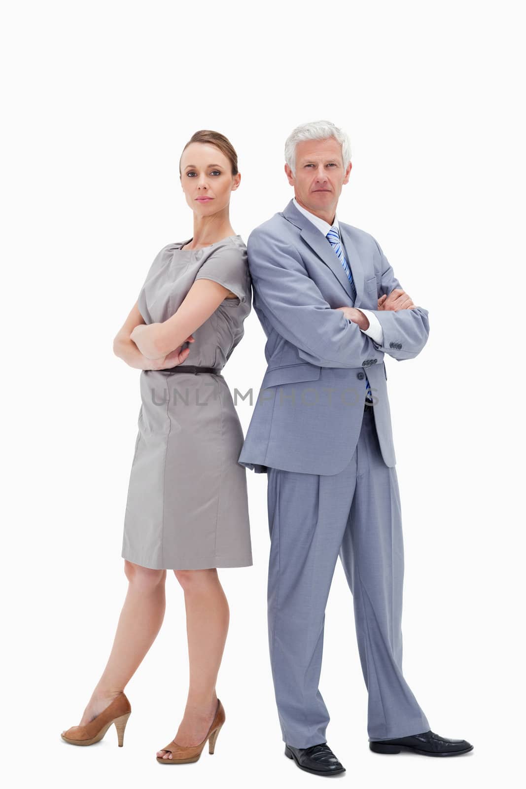 Serious white hair businessman back to back with a woman against white background