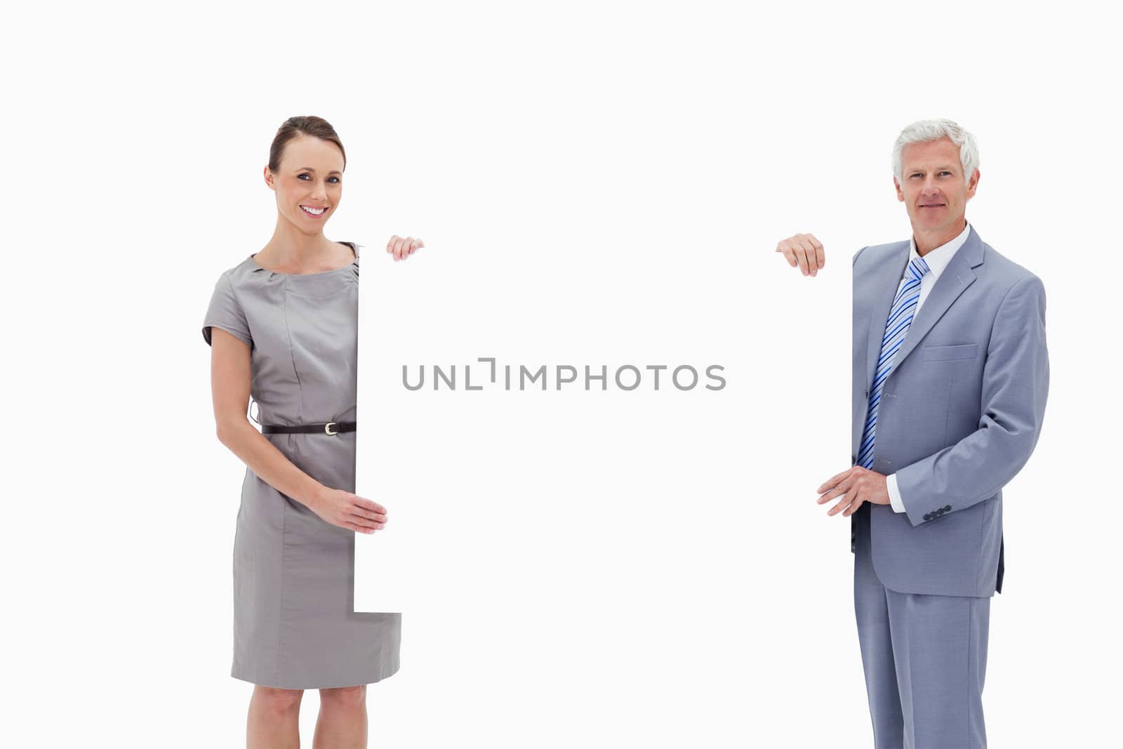 White hair businessman holding a big white sign with a woman against white background