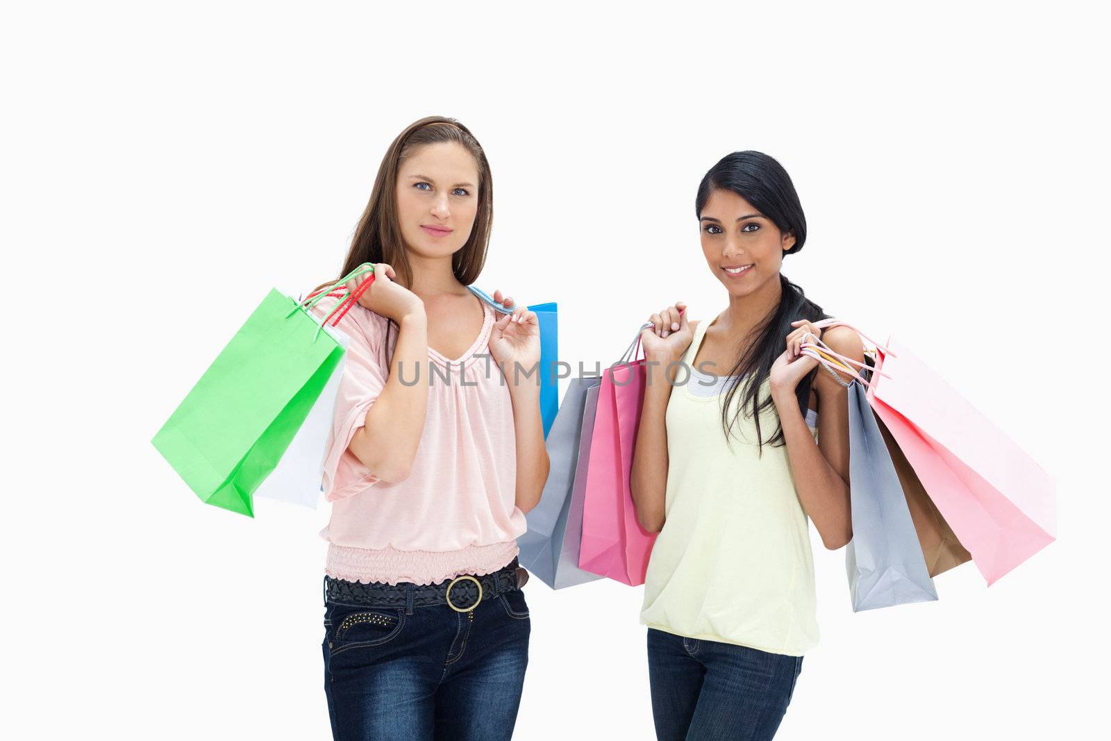 Girls with shopping bags against white background