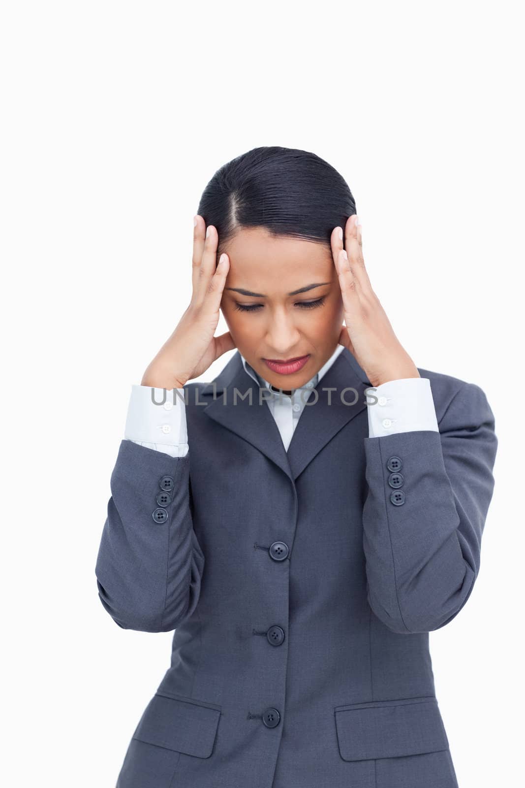 Close up of saleswoman rubbing her temples against a white background