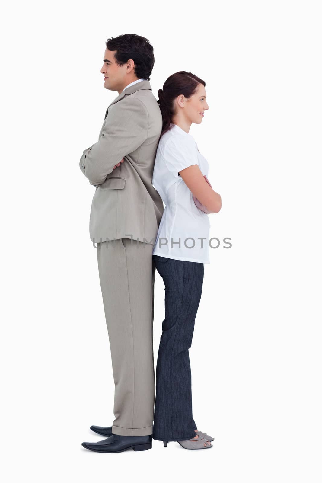 Salesteam standing back to back against a white background