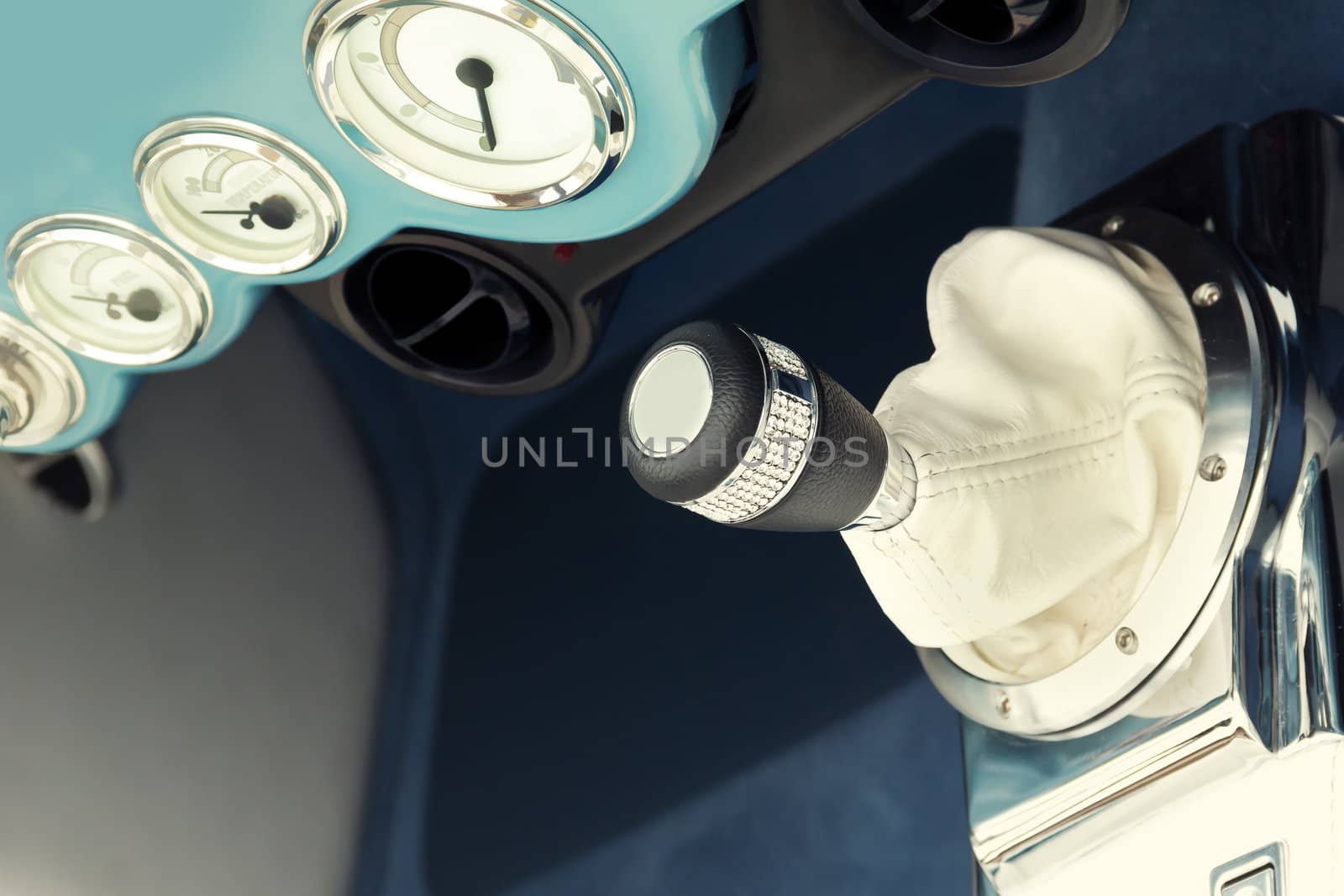 A Stick Shift Lever and interior of a Classic Car