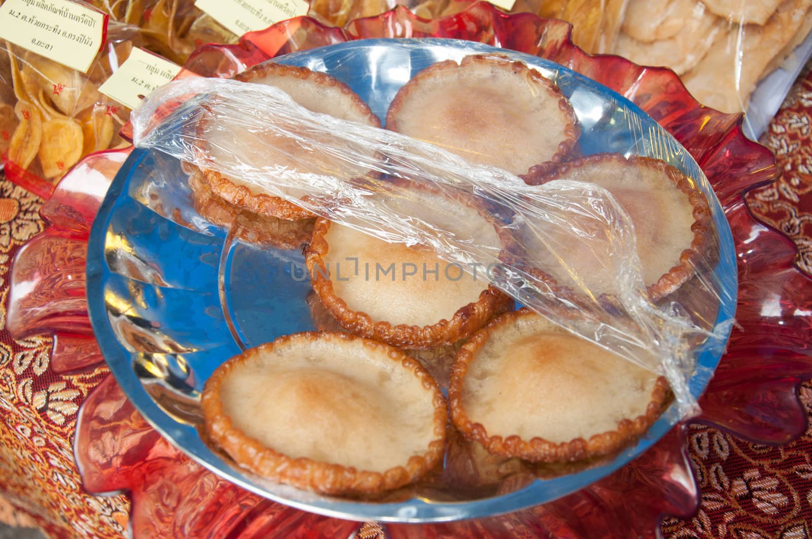 fried powder sweet dessert on dish by ngarare