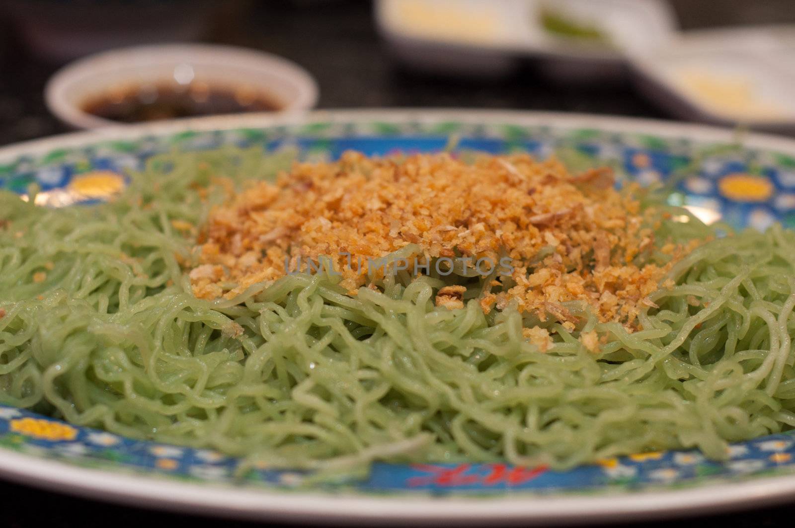 fried green noodle on dish by ngarare