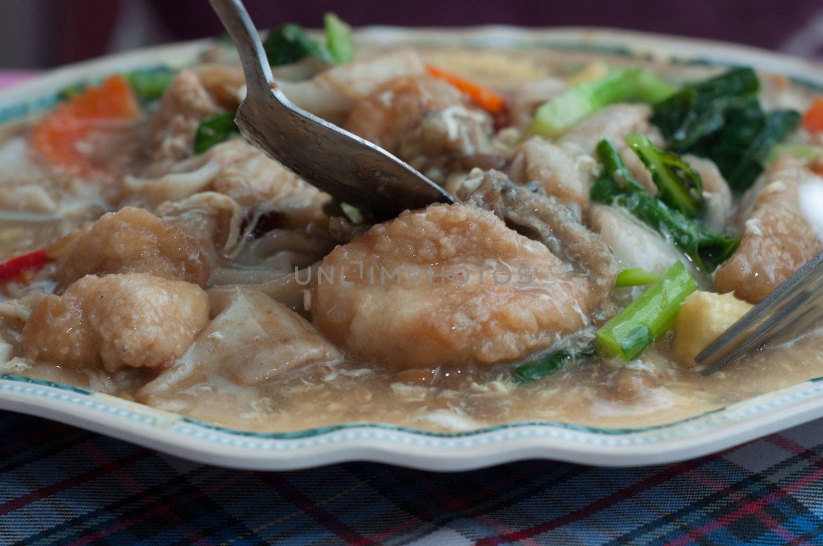 fried fish with vegetable on dish