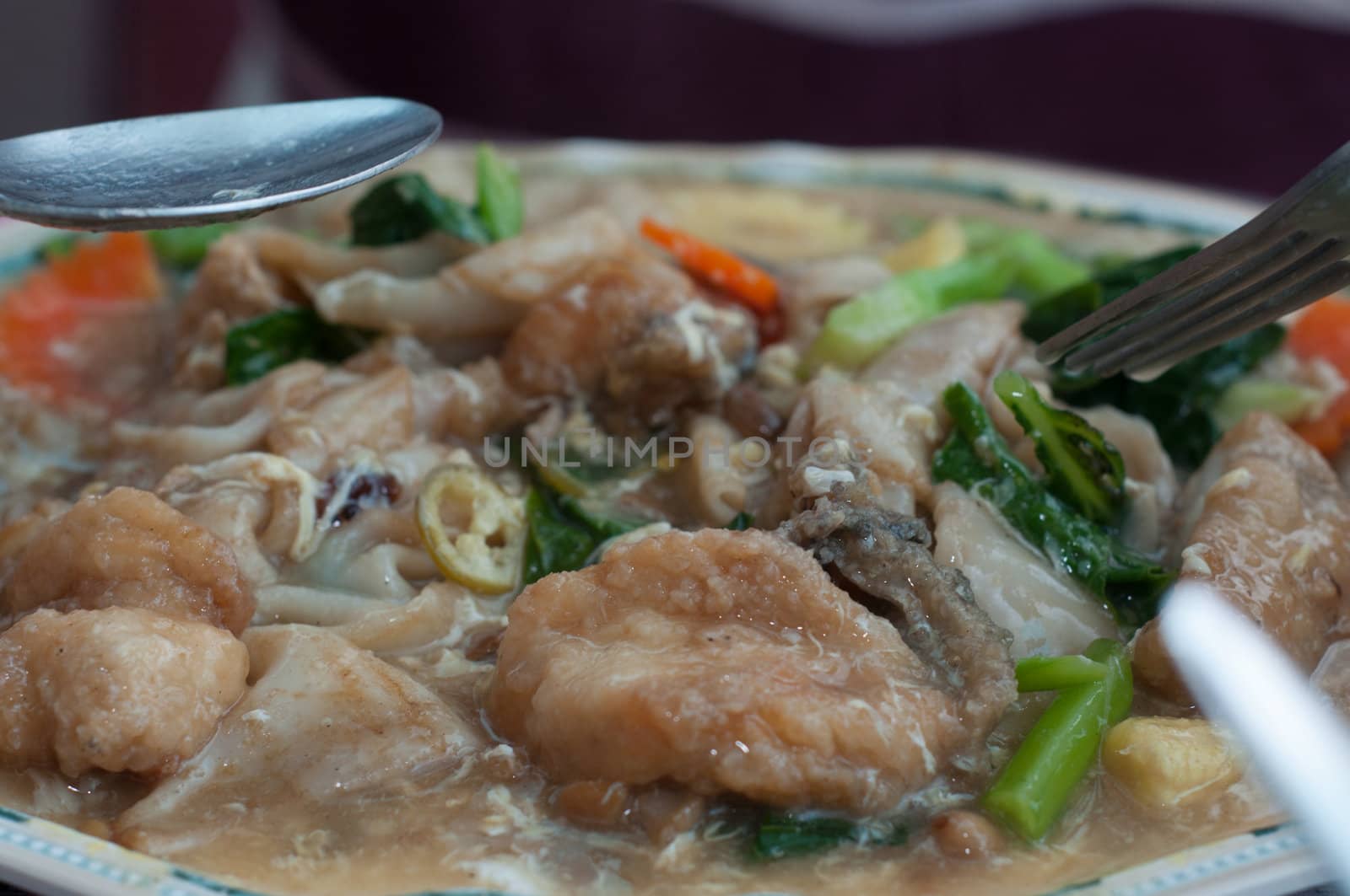 fried fish with vegetable on dish