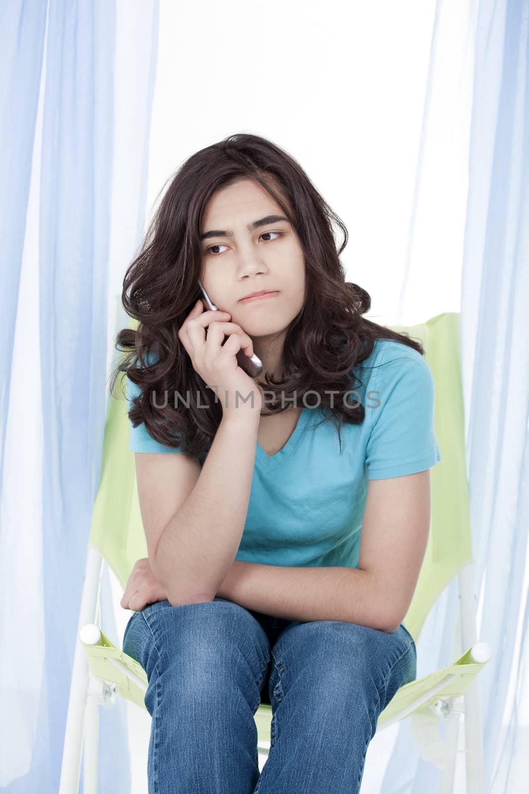 Teen girl or young woman having stressful phone conversation by jarenwicklund