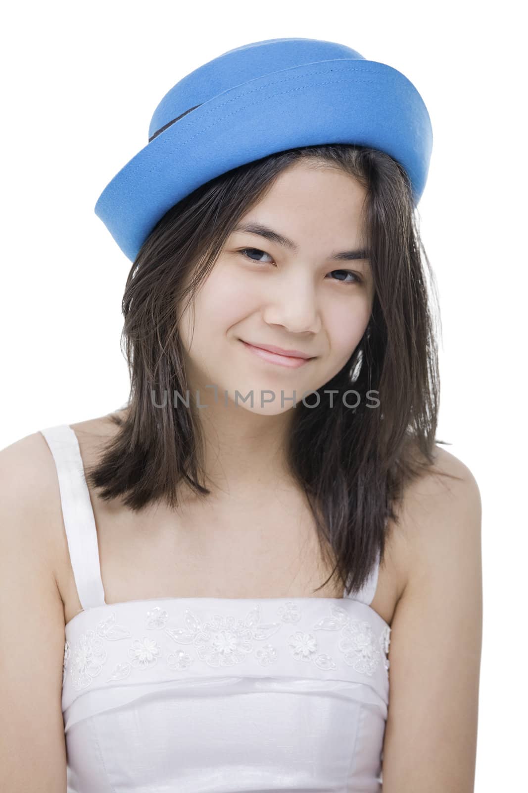 Young teenage girl in blue hat. Isolated on white. by jarenwicklund