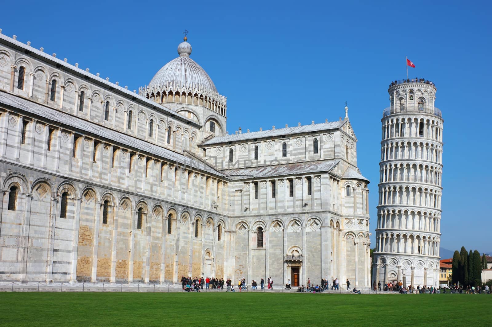 Famous Leaning Tower in Pisa on piazza dei Miracoli in Pisa, Italy. Shot in a bright sunny day.