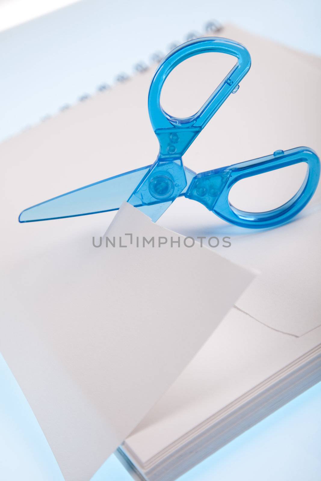 Scissors cutting paper