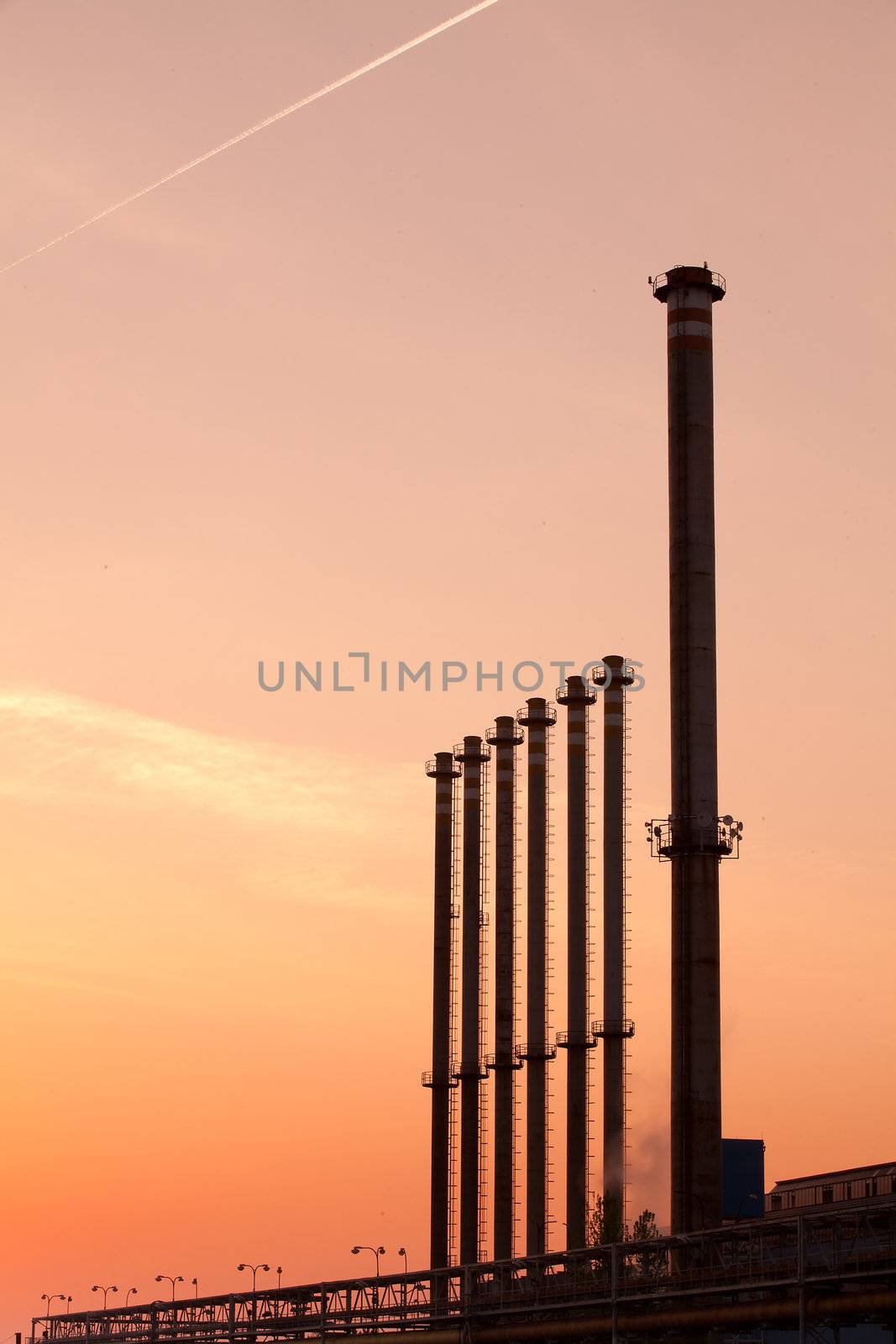 Factory chimneys at sunrise
