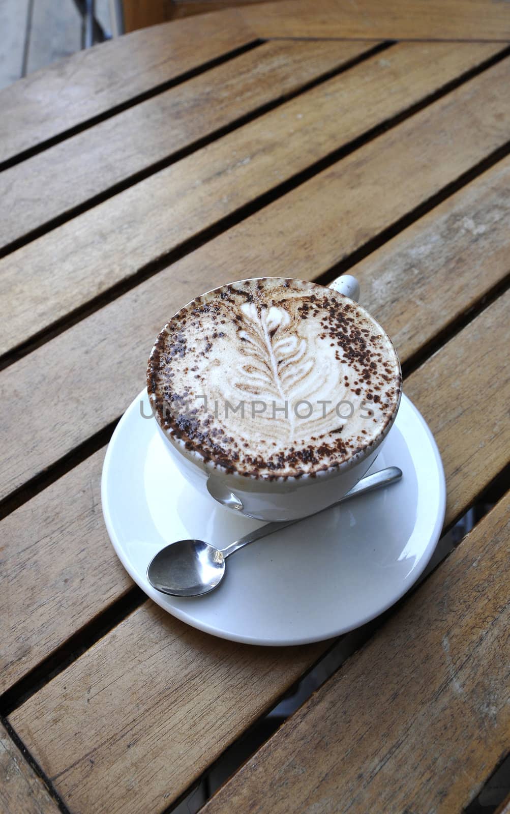 Cup of Coffe with Cream and Chocolate powder