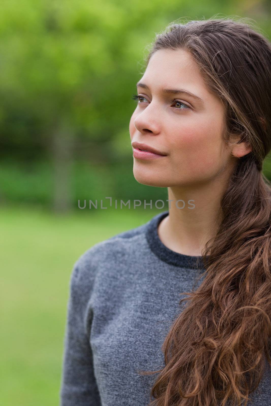 Thoughtful young girl looking towards the side by Wavebreakmedia
