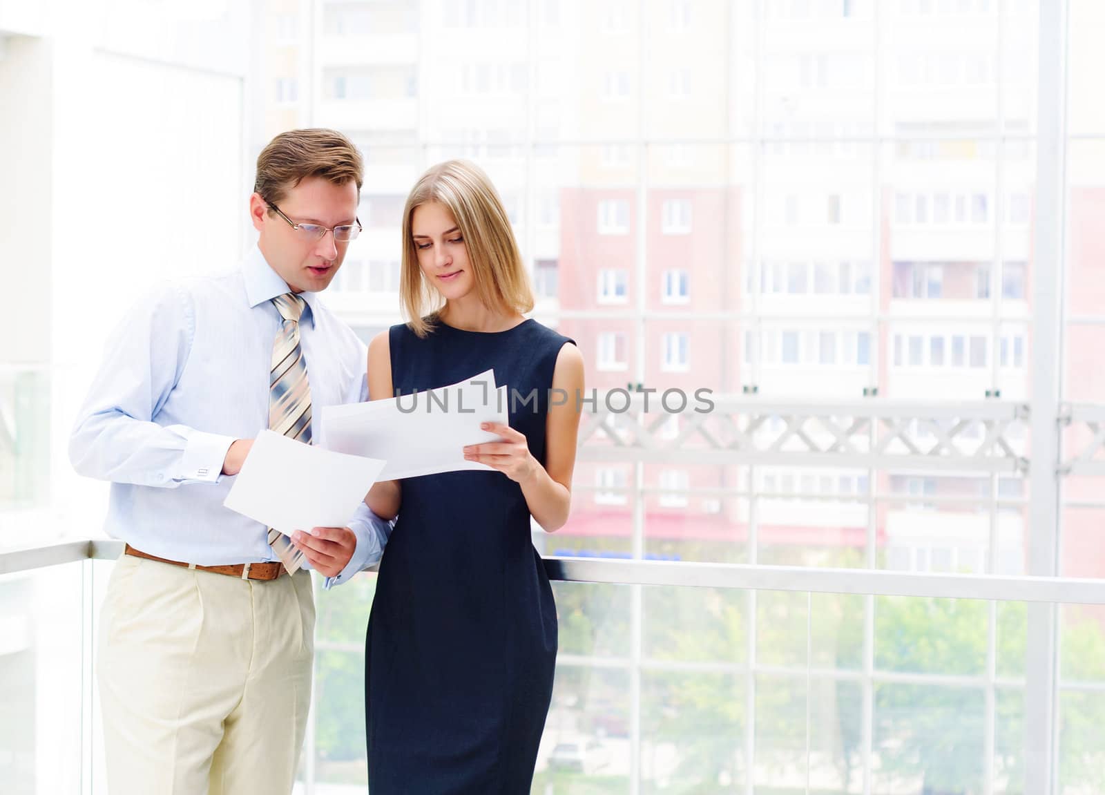 Portrait of young male and female entrepreneurs working together