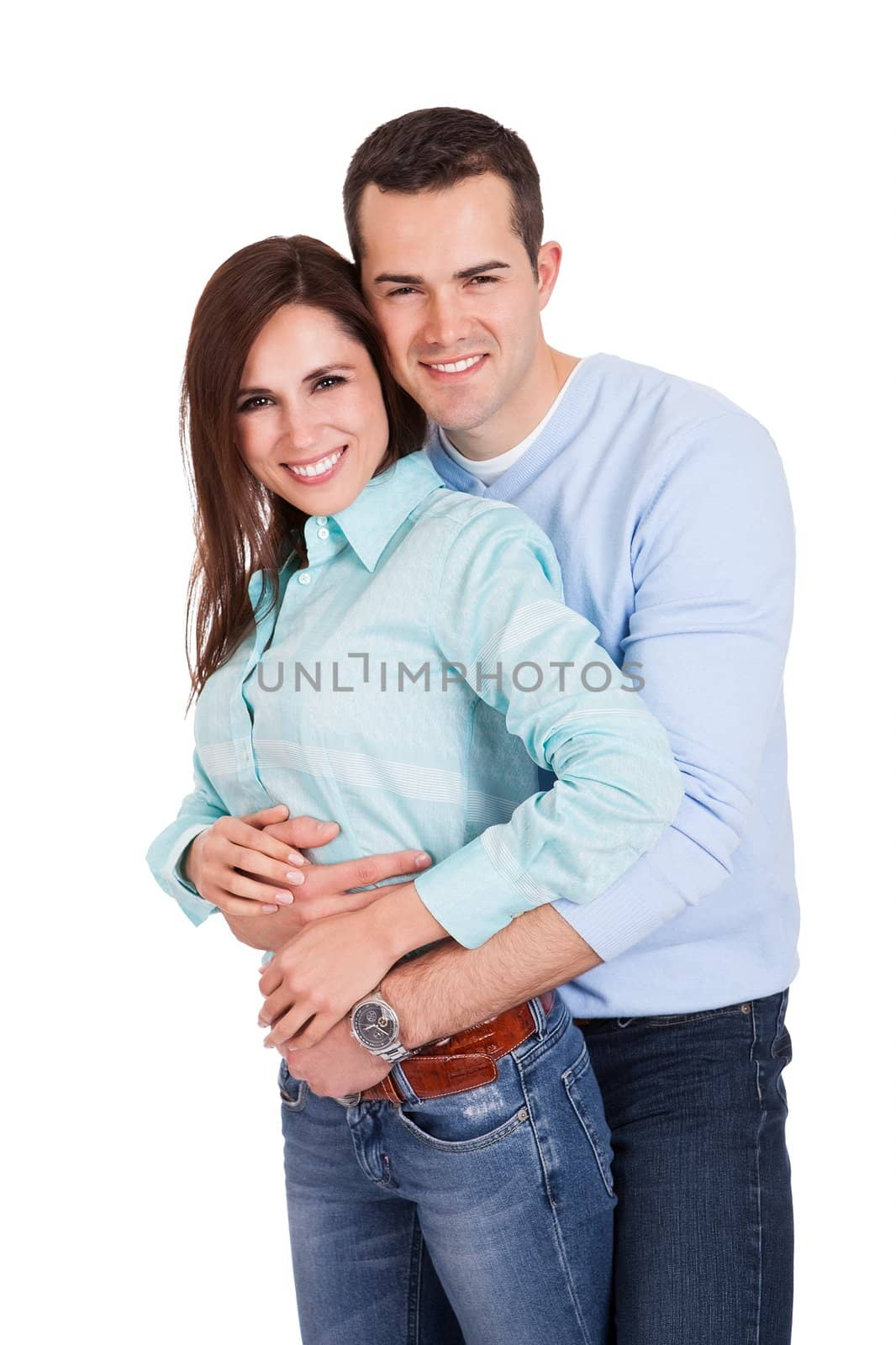 Portrait of beautiful young couple. Isolated on white