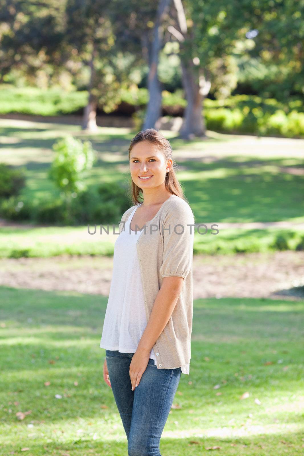 Smiling woman in the park by Wavebreakmedia