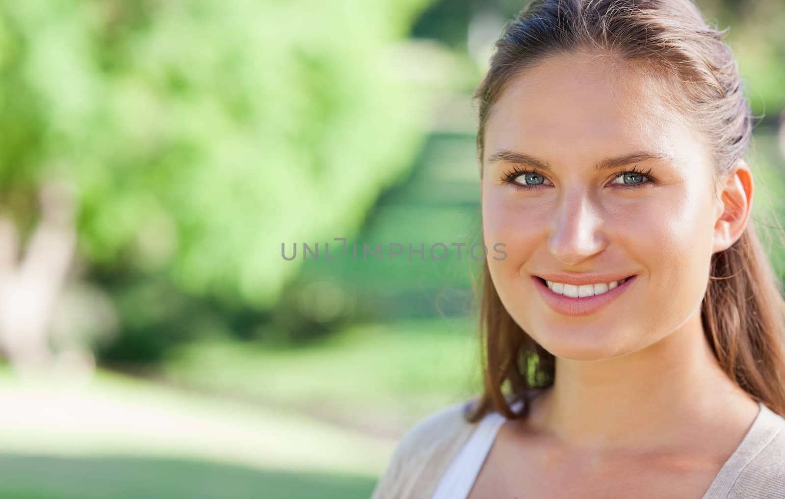 Smiling woman spending her day in the park by Wavebreakmedia