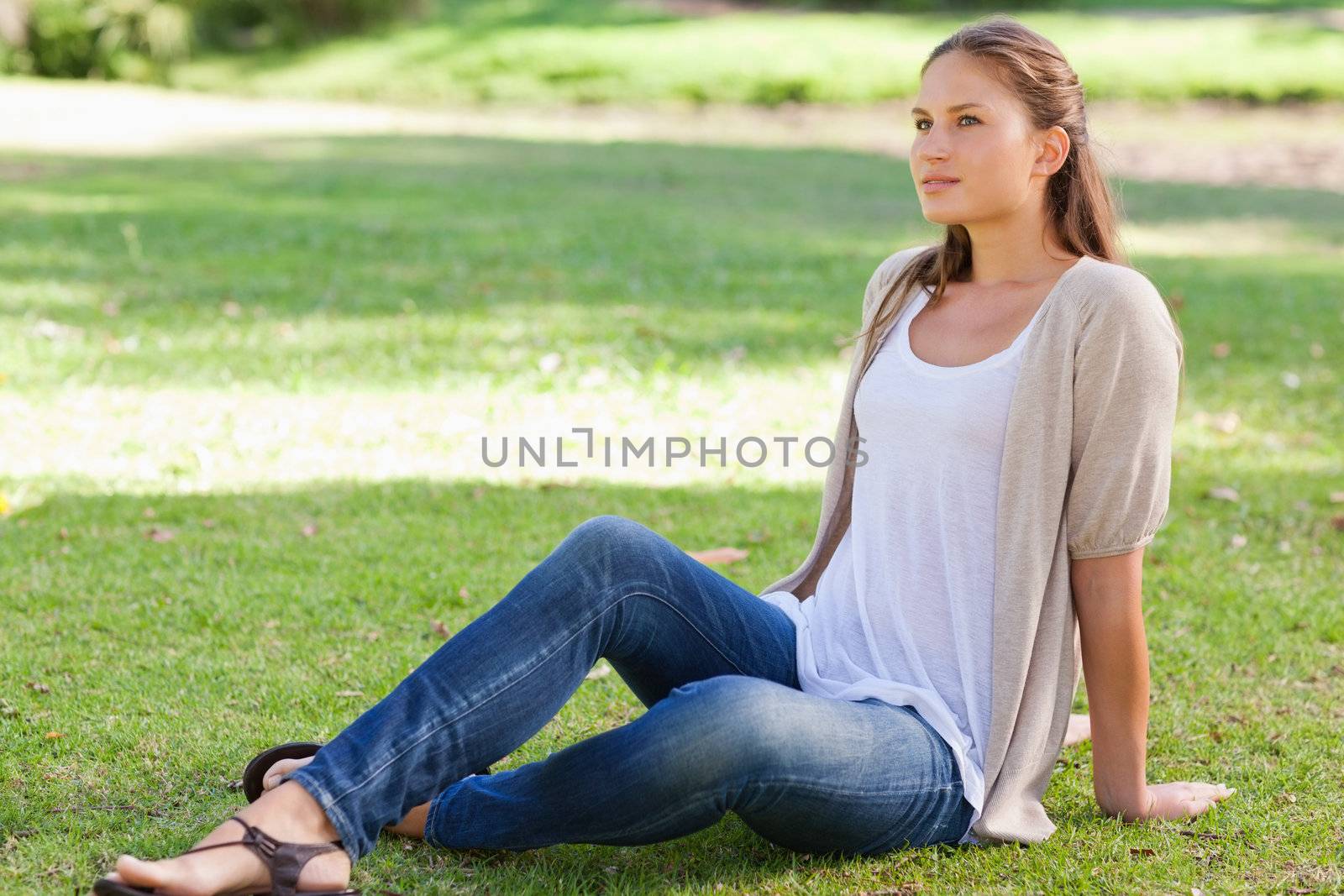 Young woman relaxing on the lawn
