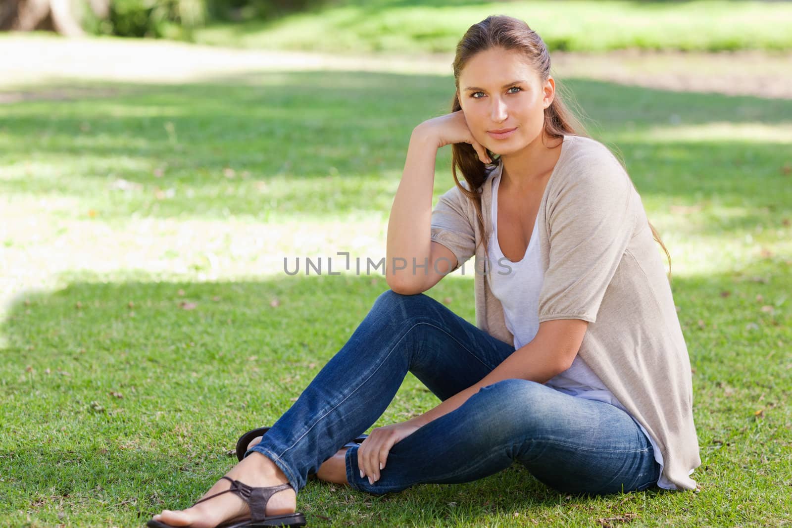 Relaxed woman enjoying her day in the park by Wavebreakmedia