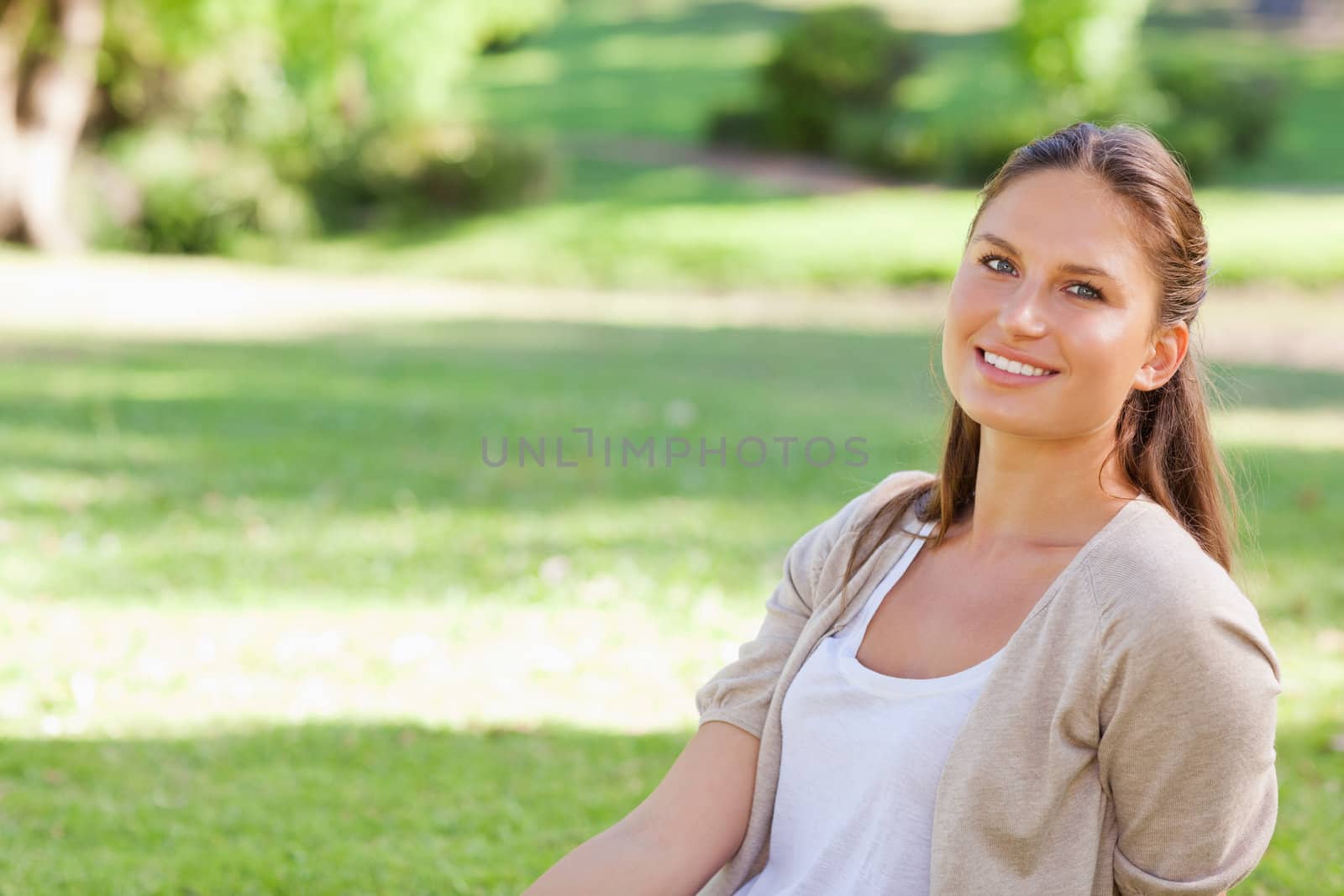 Smiling young woman enjoying her day in the park