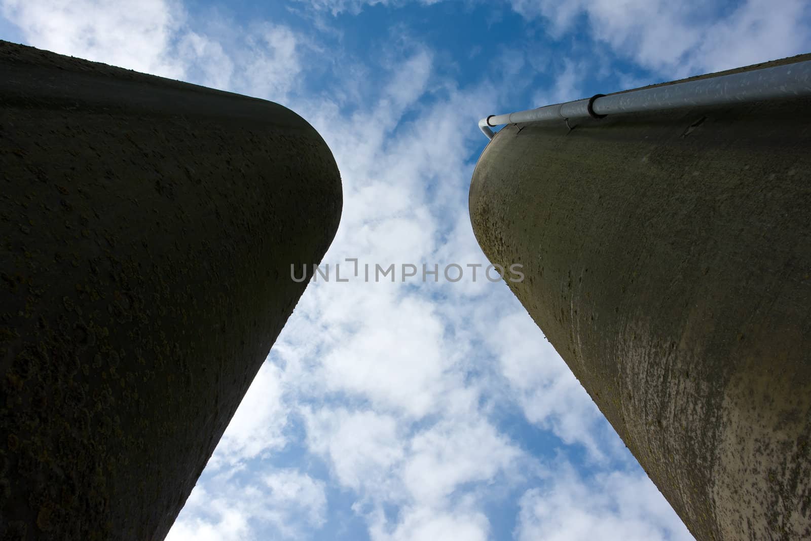 Agriculture farm grain silos in vertical angle facing the sky