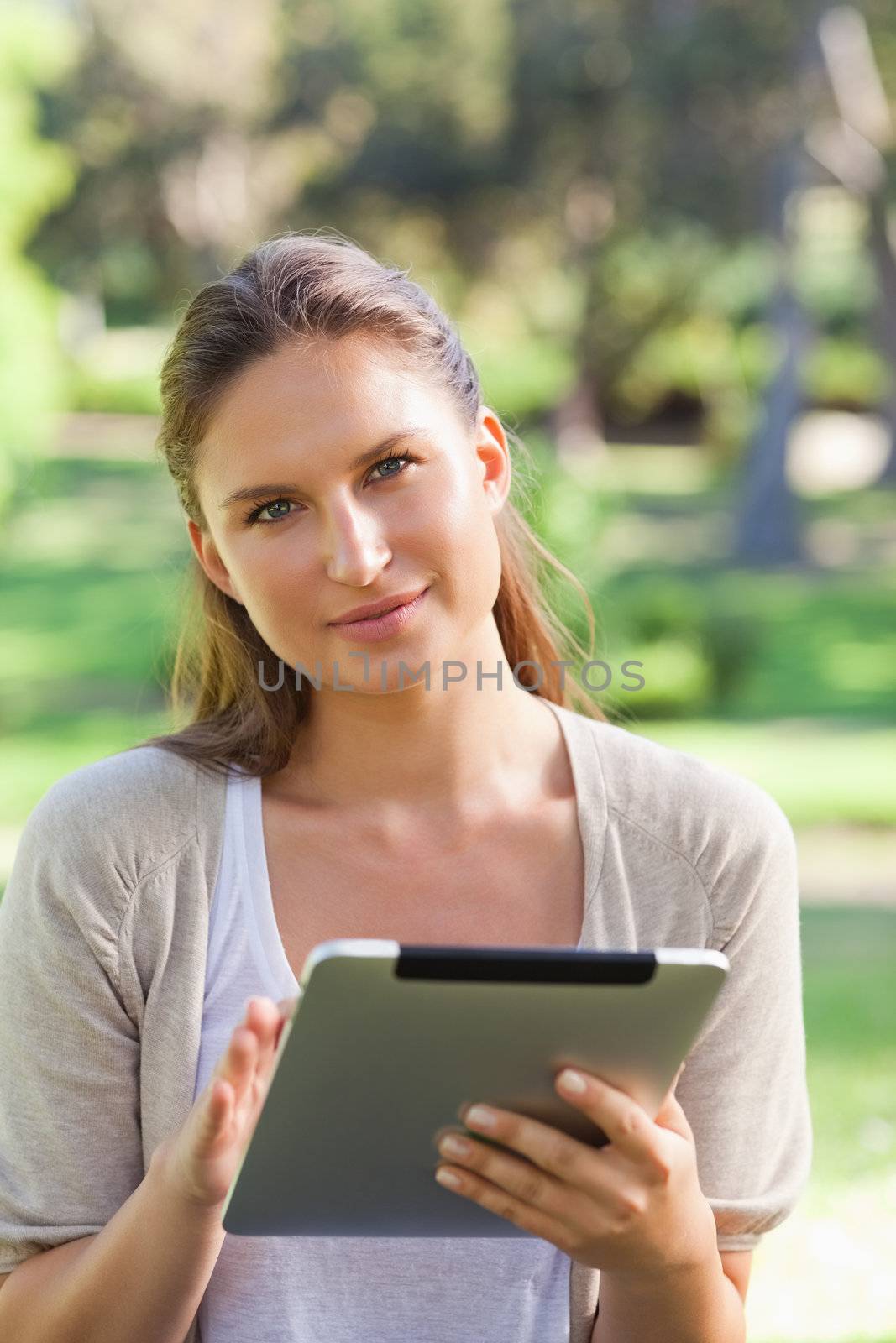 Woman with a tablet computer in the countryside by Wavebreakmedia