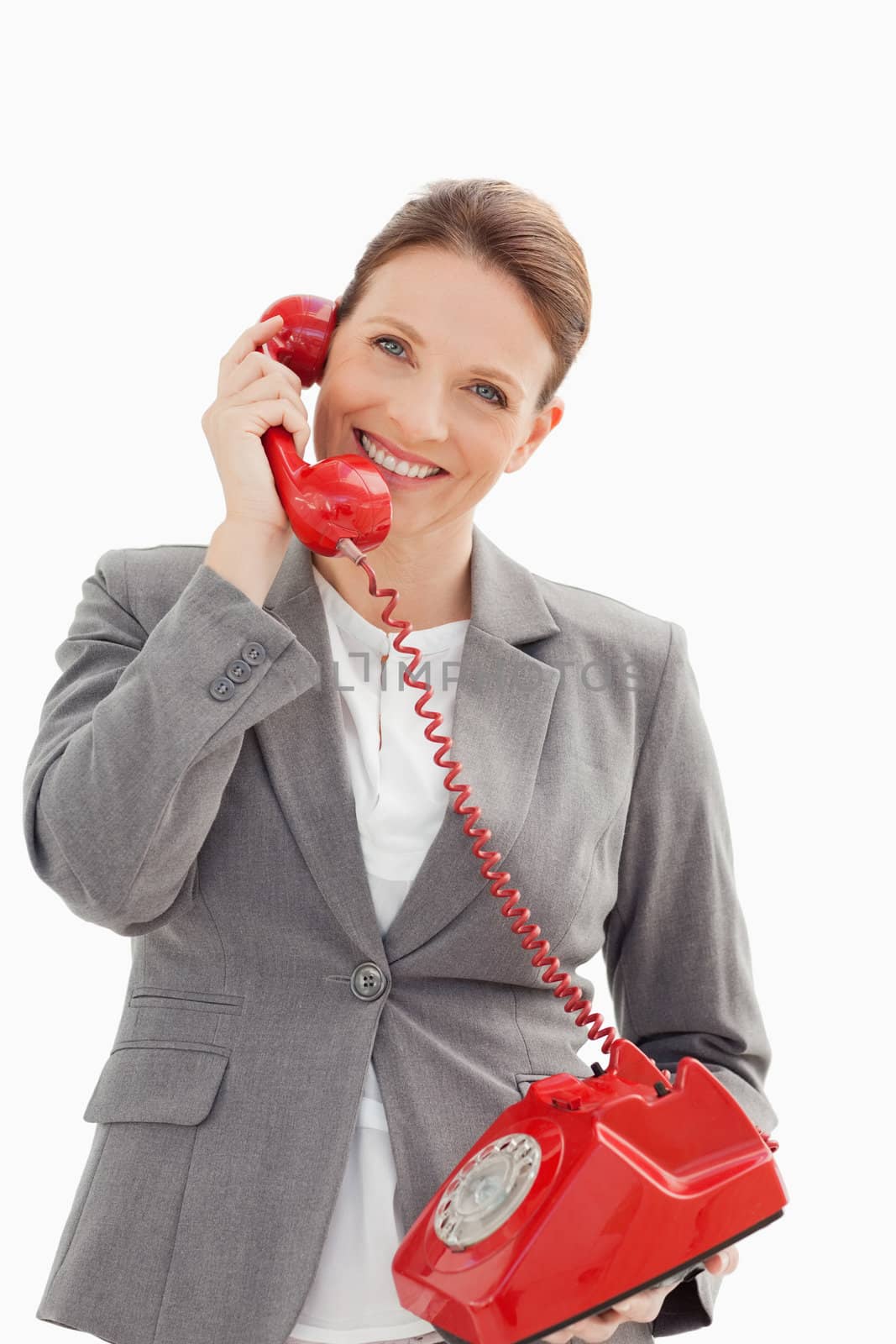 A happy businesswoman is talking on the phone