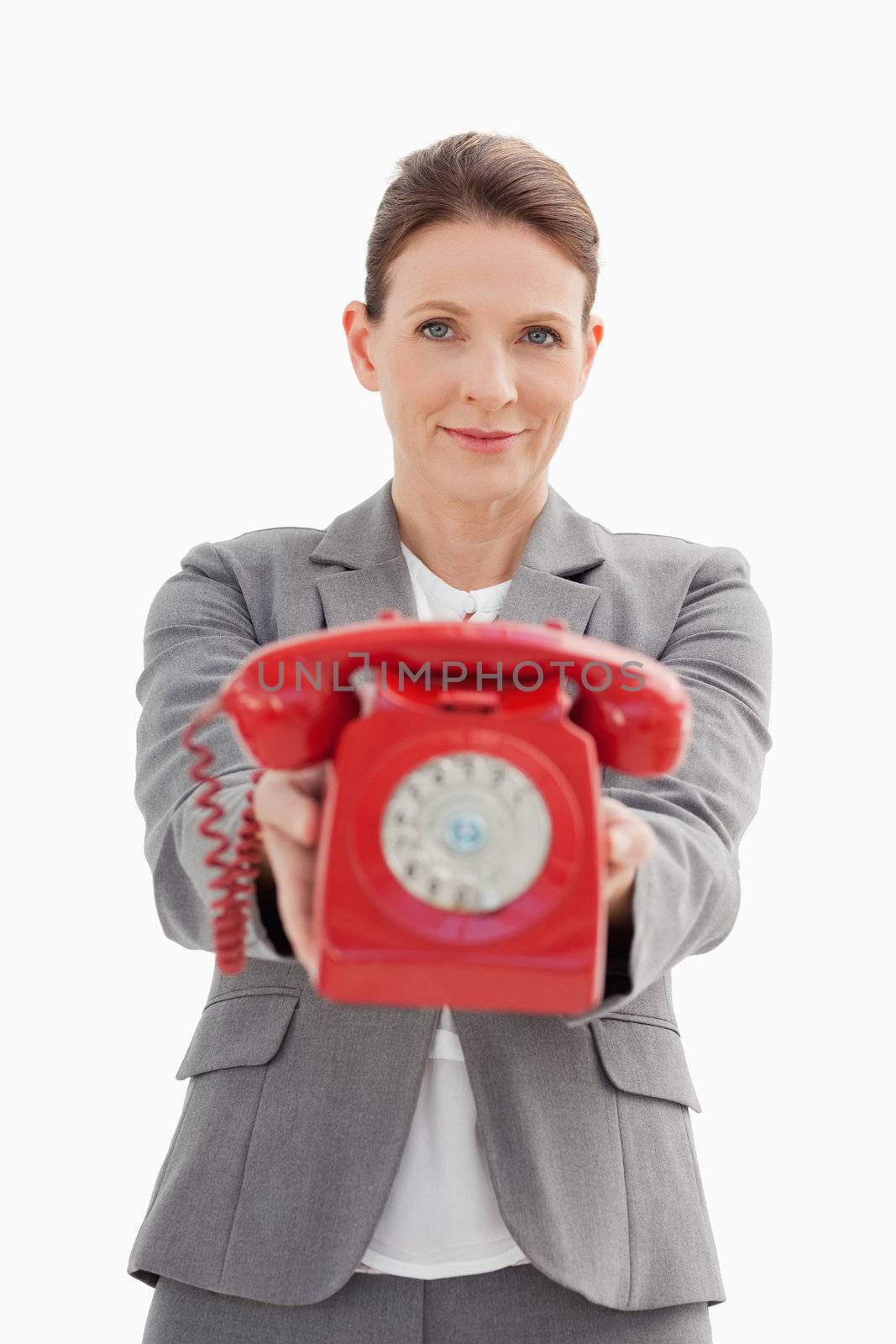 Businesswoman holding out the phone by Wavebreakmedia