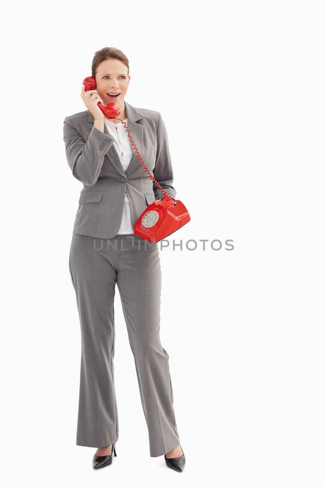 Surprised businesswoman talking on the phone by Wavebreakmedia